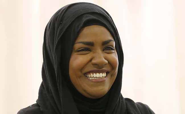 "The Great British Bake Off" TV show winner Nadiya Hussain smiles as she poses for photographers in London, Thursday, Oct. 8, 2015. Nadiya Hussain was crowned winner of the contest Wednesday on a program watched by 13.4 million people, one in five of the British population and the biggest TV audience of the year./ Picture by: Frank Augstein / AP/Press Association Images.