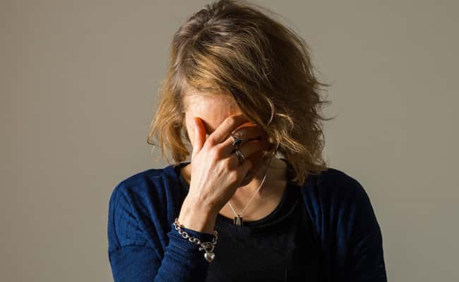 Photo: a woman showing signs of depression, as a report suggests that rising numbers of young people are suffering from mental health issues such as anxiety and stress./Picture by: Dominic Lipinski / PA Wire/Press Association Images.