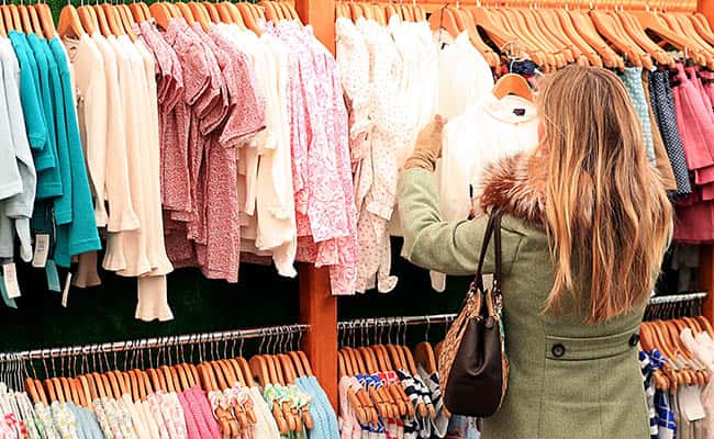 Picture by: Mike Egerton / PA Wire/Press Association Images File photo dated 16/3/2016 of a woman looking at children's clothes. UK inflation lifted to its highest level for 15 months in March as the rising cost of clothes and air fares pushed up the cost of living.