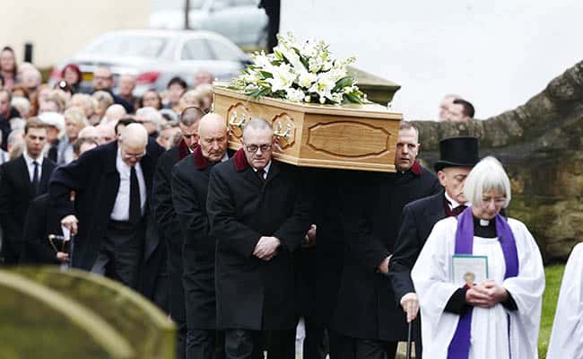 The coffin of TV agony aunt Denise Robertson is carried into Sunderland Minster for her funeral.