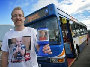Ian Thompson with his fundraising shirt and collection tin.