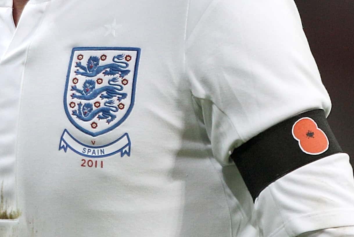 File photo dated 12/11/11 of an England player wearing a black armband with a poppy symbol. A Fifa ban on football players displaying poppies is insulting to British fans, chairman of the Commons Sports Committee Damian Collins has said.