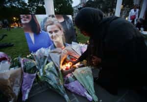 File photo dated 16/6/2016 of a woman laying some flowers at Parliament Square opposite the Palace of Westminster, central London, in tribute to Jo Cox, who died after being shot and stabbed in the street outside her constituency advice surgery in Birstall, West Yorkshire. Thomas Mair has been found guilty at the Old Bailey, London of the murder of the Labour MP.